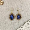 processed_49aa4ad76b094183ba8d930bdfe05e46.webp Deathly Attraction Earrings