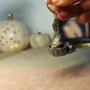 100001145628129.webp Totoro drinking tea in a teacup – Handmade Clay Keychain