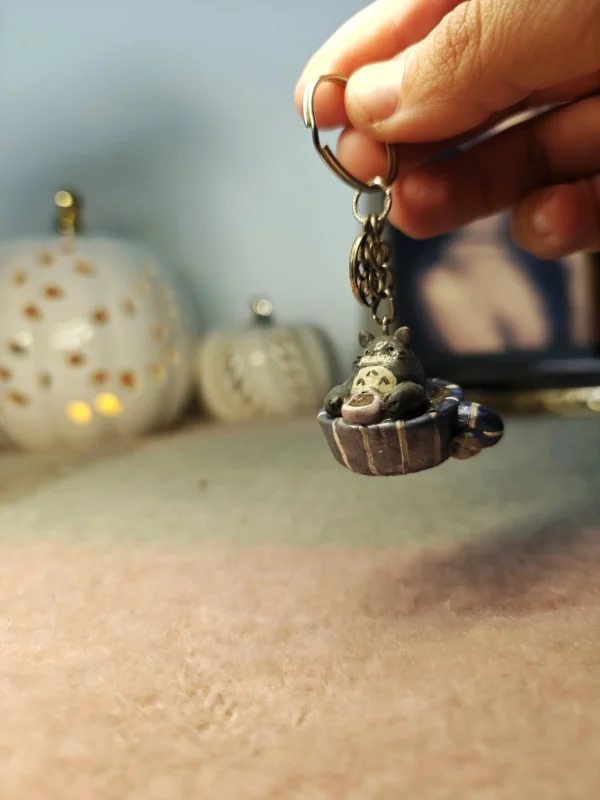 100001145628129.webp Totoro drinking tea in a teacup – Handmade Clay Keychain