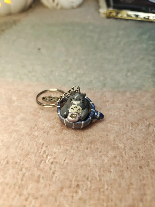 1000011458.webp Totoro drinking tea in a teacup – Handmade Clay Keychain