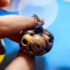https3A2F2Fi.etsystatic.com2F113947292Fr2Fil2F0218ec2F51254903362Fil_fullxfull.5125490336_t1t1.webp Creepy Golden Pumpkins Keychains