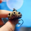 https3A2F2Fi.etsystatic.com2F113947292Fr2Fil2F818d552F51737151472Fil_fullxfull.5173715147_bbxb.webp Creepy Golden Pumpkins Keychains