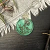processed_77b48a474c05432cb6f1be06c670793b.webp Flower Potion Keychains