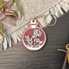 processed_a545b7ca6b5f4944bf6b8061ea824804.webp Flower Potion Keychains