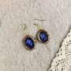 processed_ca0fd53e01a3405dbf1e3e44e39e7fb8.webp Deathly Attraction Earrings